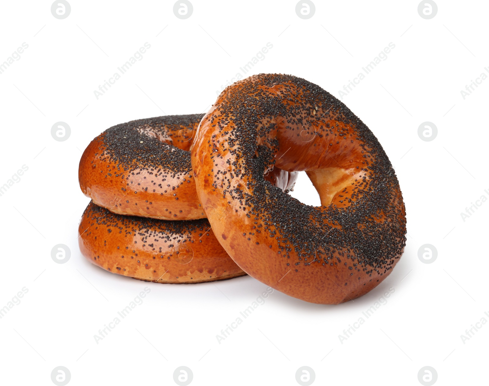 Photo of Delicious fresh bagels with poppy seeds isolated on white