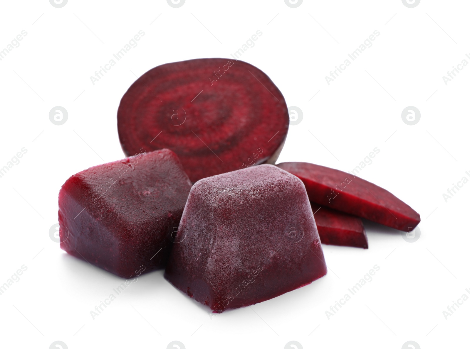 Photo of Frozen beetroot puree cubes and fresh beetroot isolated on white