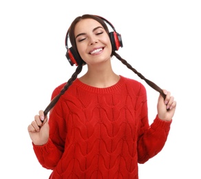 Photo of Young woman listening to music with headphones on white background