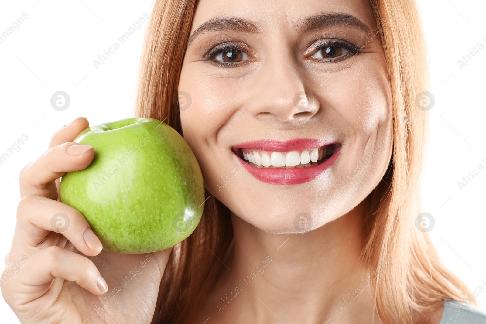 Photo of Smiling woman with perfect teeth and green apple on white background, closeup