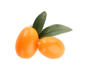 Fresh ripe kumquats with leaves on white background, top view. Exotic fruit