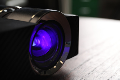 Closeup view of modern digital video projector on table