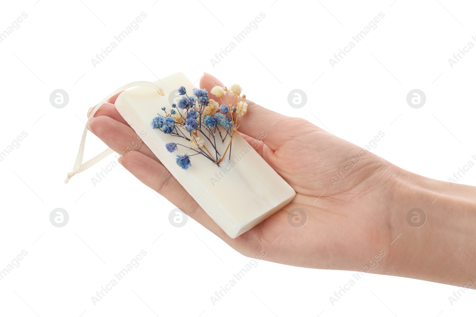 Photo of Woman holding scented sachet with flowers on white background, closeup