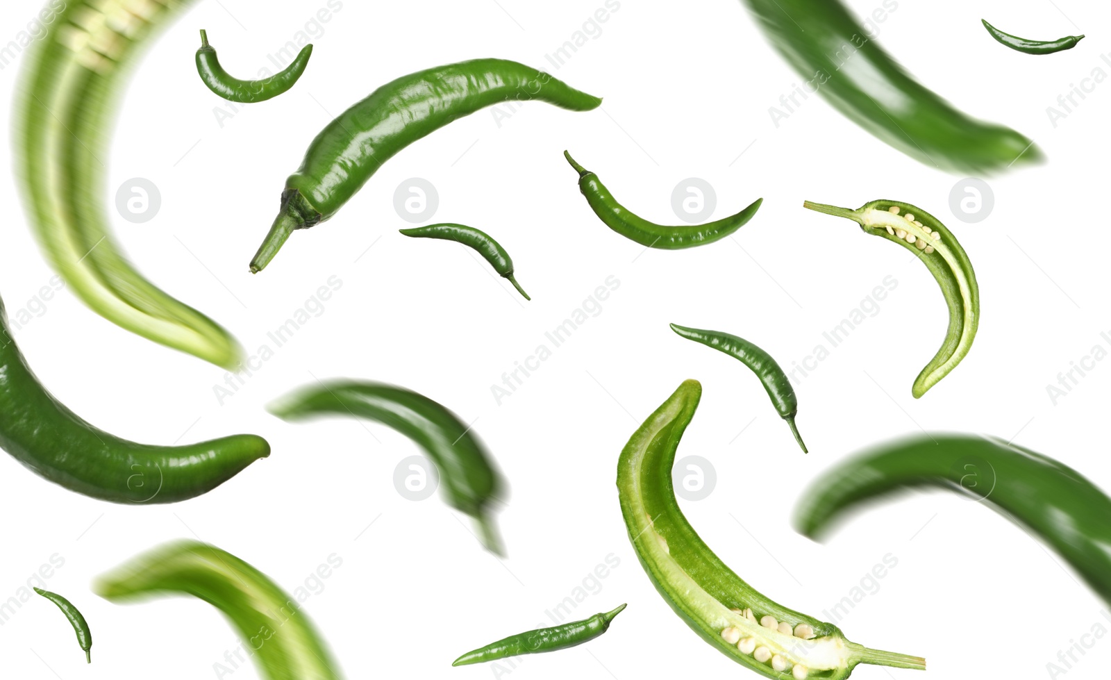 Image of Green chili peppers falling on white background 