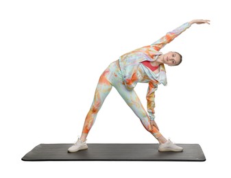 Photo of Yoga workout. Young woman stretching on white background