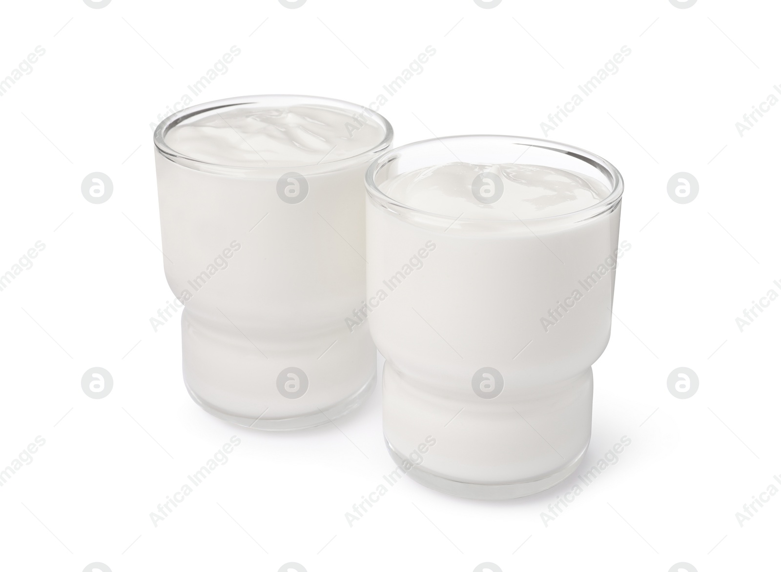 Photo of Glasses with delicious organic yogurt on white background