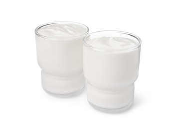 Glasses with delicious organic yogurt on white background