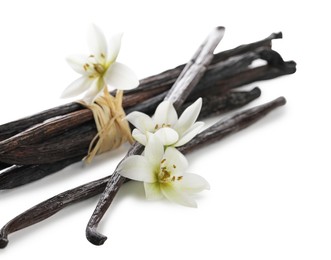 Photo of Vanilla pods and flowers isolated on white