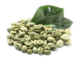 Pile of green coffee beans and leaves on white background