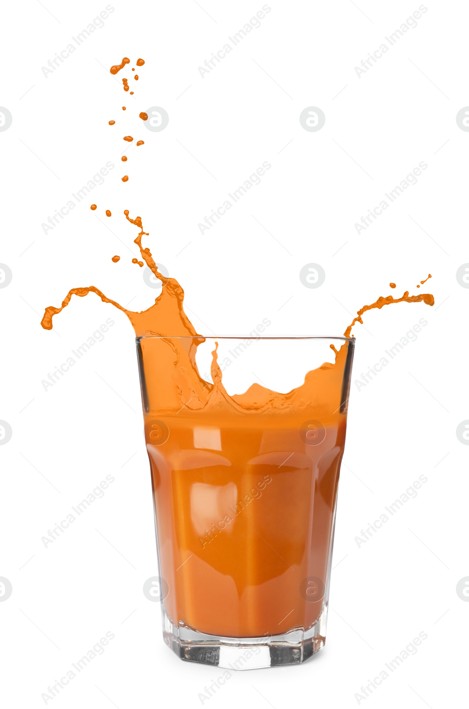 Image of Glass of fresh carrot juice with splashes on white background