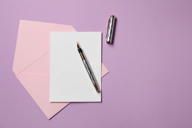 Photo of Blank sheet of paper, letter envelope and pen on violet background, top view. Space for text