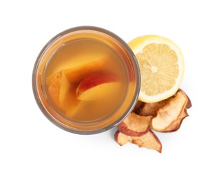 Delicious compot with dried apple slices and lemon on white background, top view