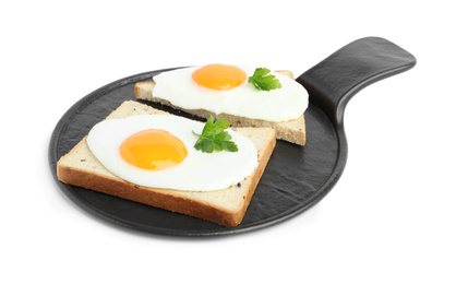 Photo of Tasty fried eggs with bread and parsley isolated on white