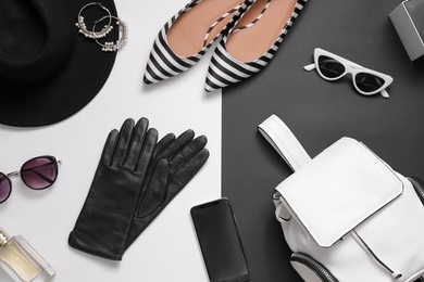 Photo of Flat lay composition with stylish black leather gloves, shoes and accessories on color background