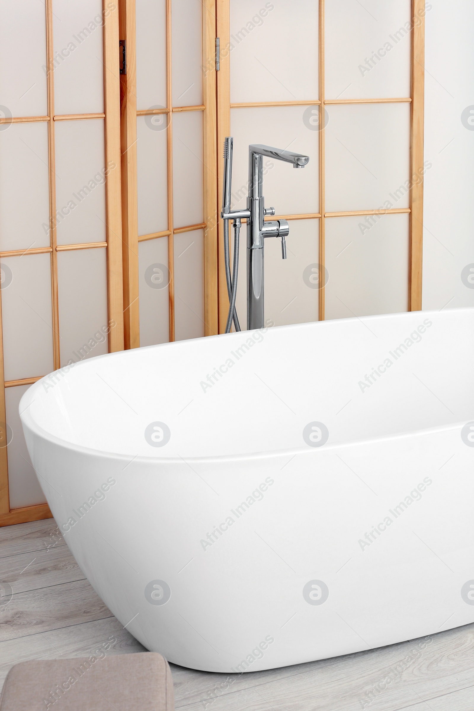 Photo of White ceramic tub in bathroom. Interior design