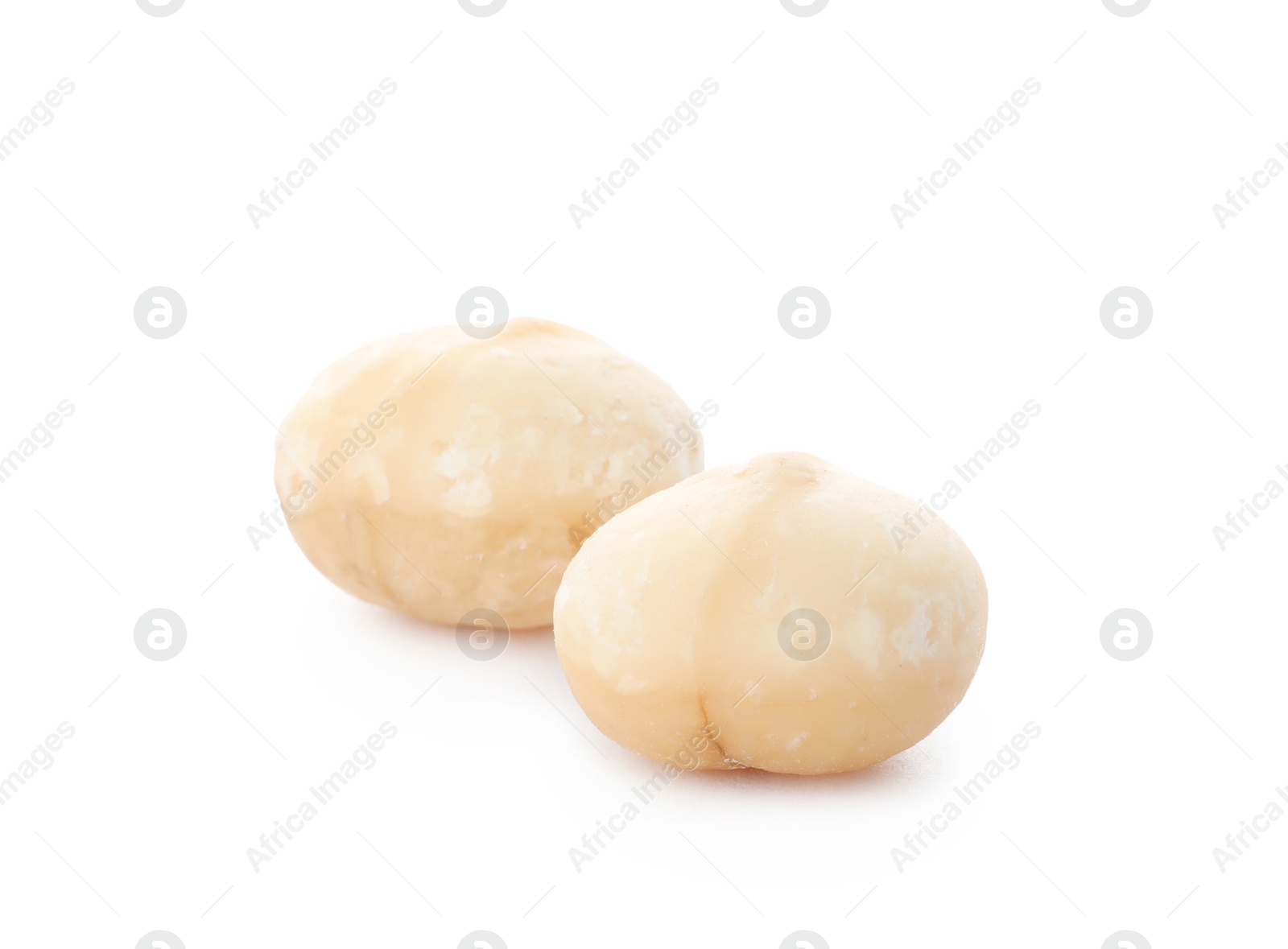 Photo of Shelled organic Macadamia nuts on white background