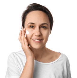 Photo of Woman applying facial cream on white background