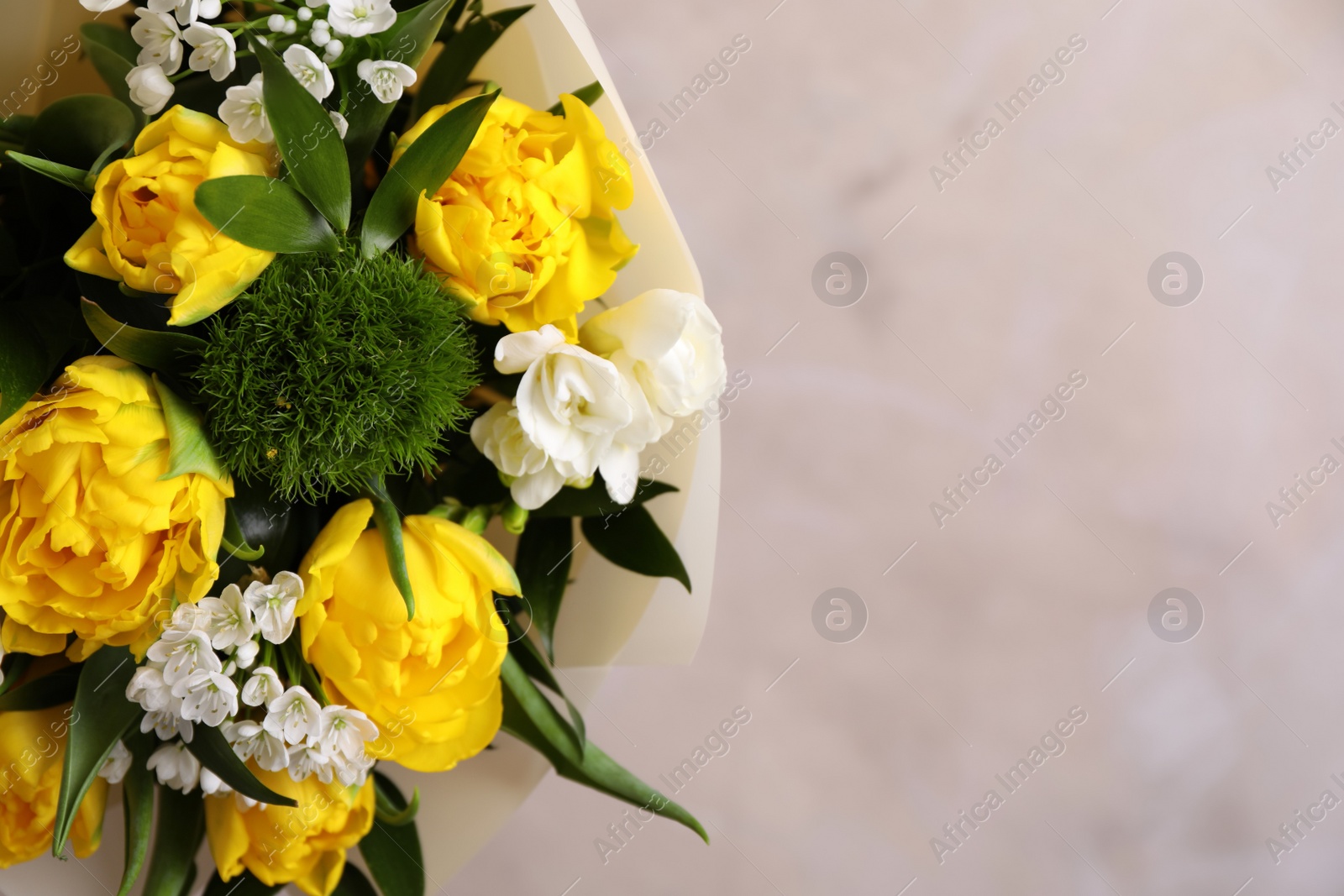 Photo of Beautiful bouquet with peony tulips on beige background, closeup. Space for text