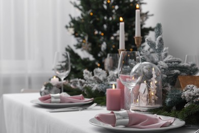 Beautiful festive table setting with Christmas decor indoors, space for text