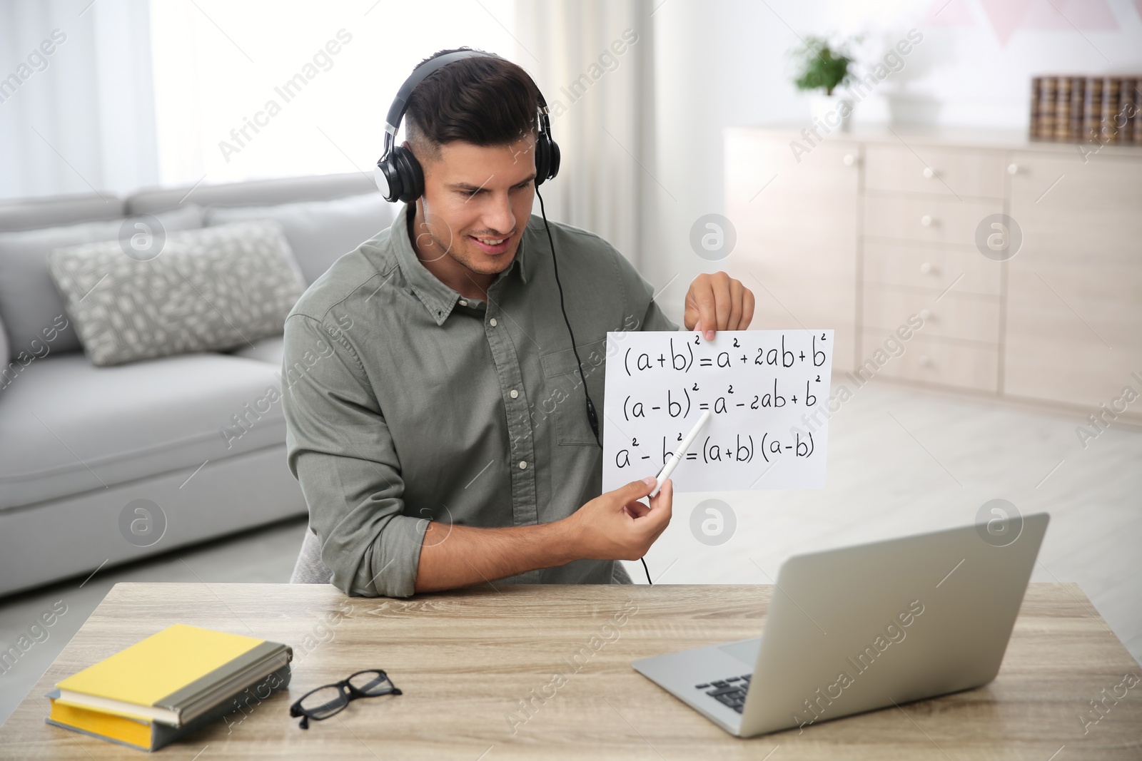 Photo of Teacher giving online lesson during quarantine. Studying at home