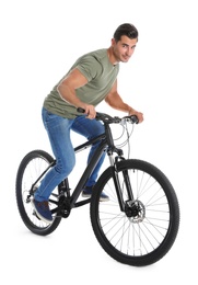 Photo of Handsome young man with modern bicycle on white background