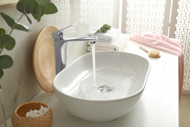 Photo of Stylish white sink in modern bathroom interior