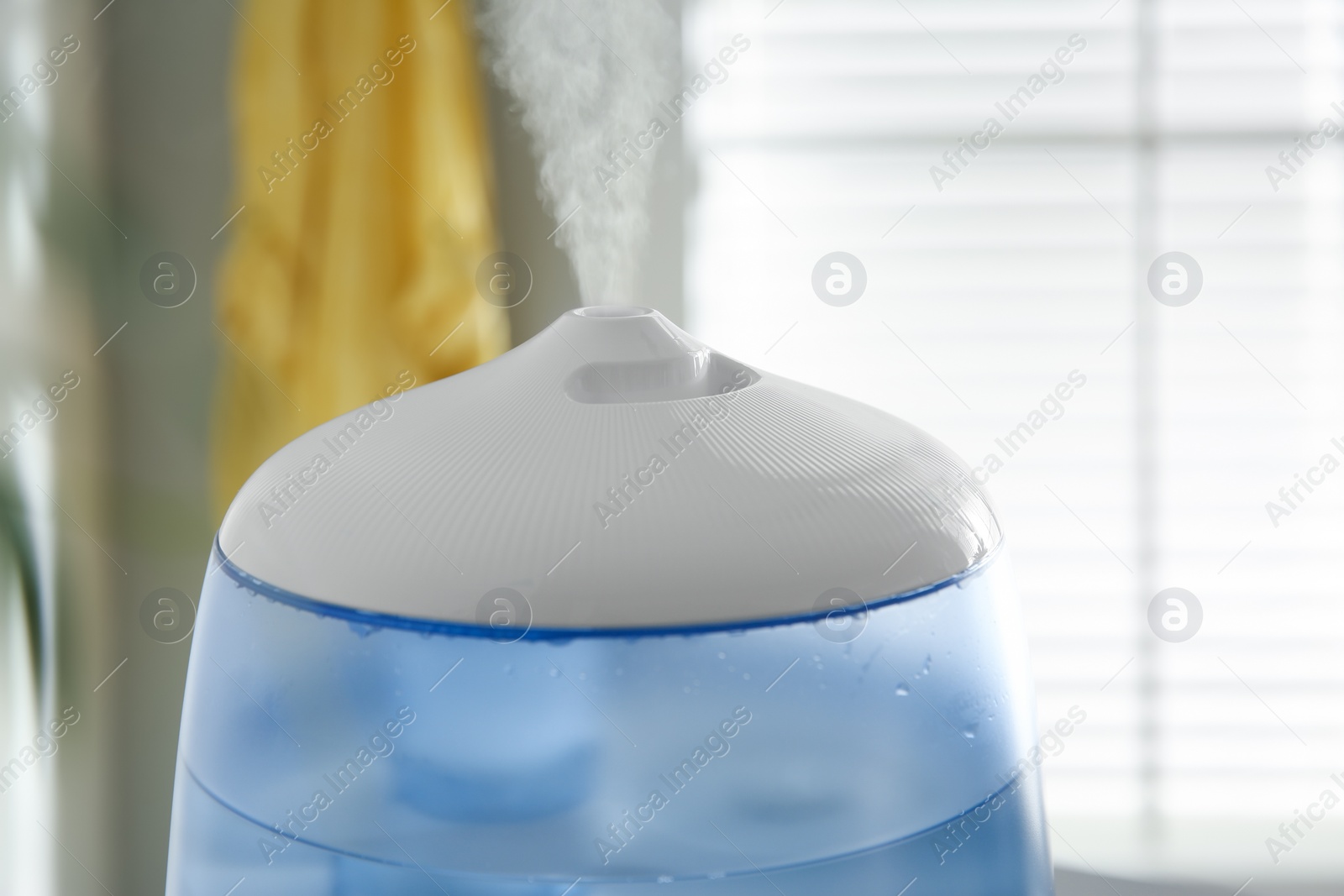 Photo of Modern air humidifier at home, closeup view