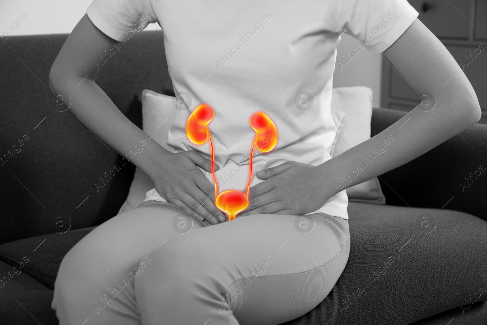 Image of Woman suffering from cystitis on sofa at home, closeup. Illustration of urinary system