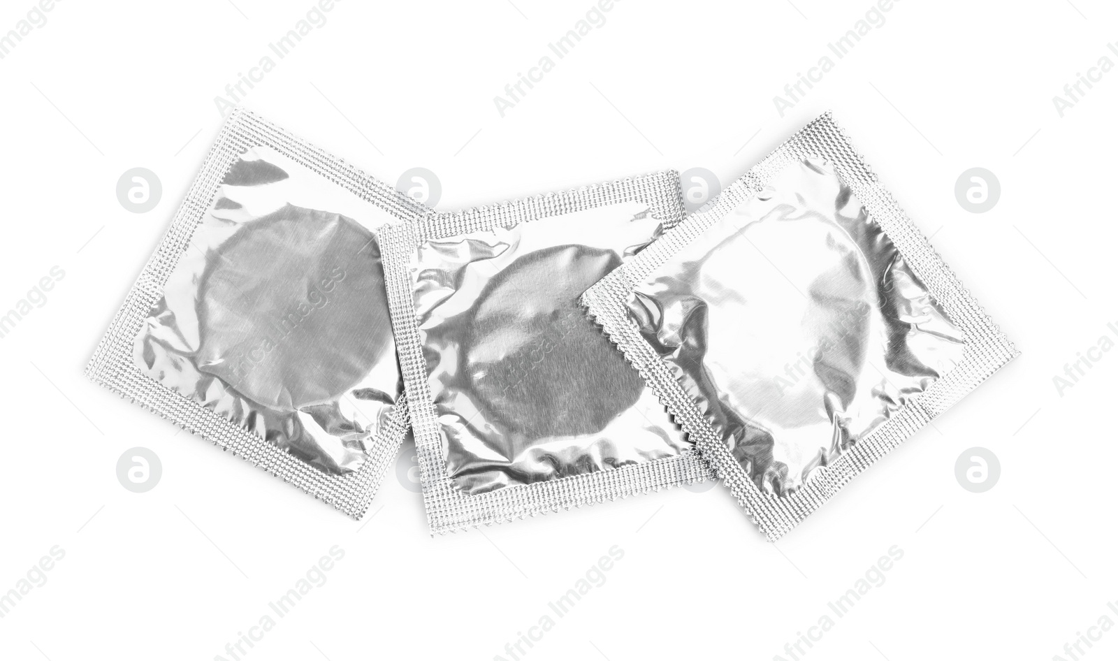 Photo of Condom packages on white background, top view. Safe sex