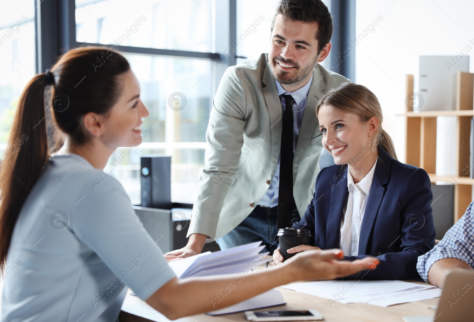 Photo of Office employees having business training at workplace