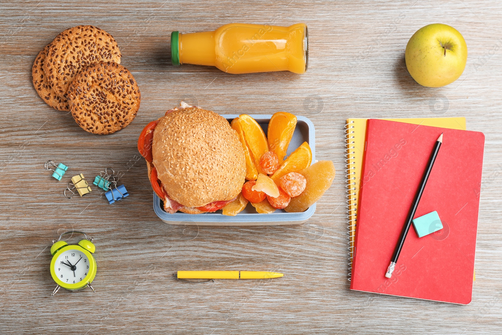 Photo of Flat lay composition with lunch box and food on wooden table