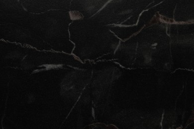 Photo of Black marble surface as background, closeup view