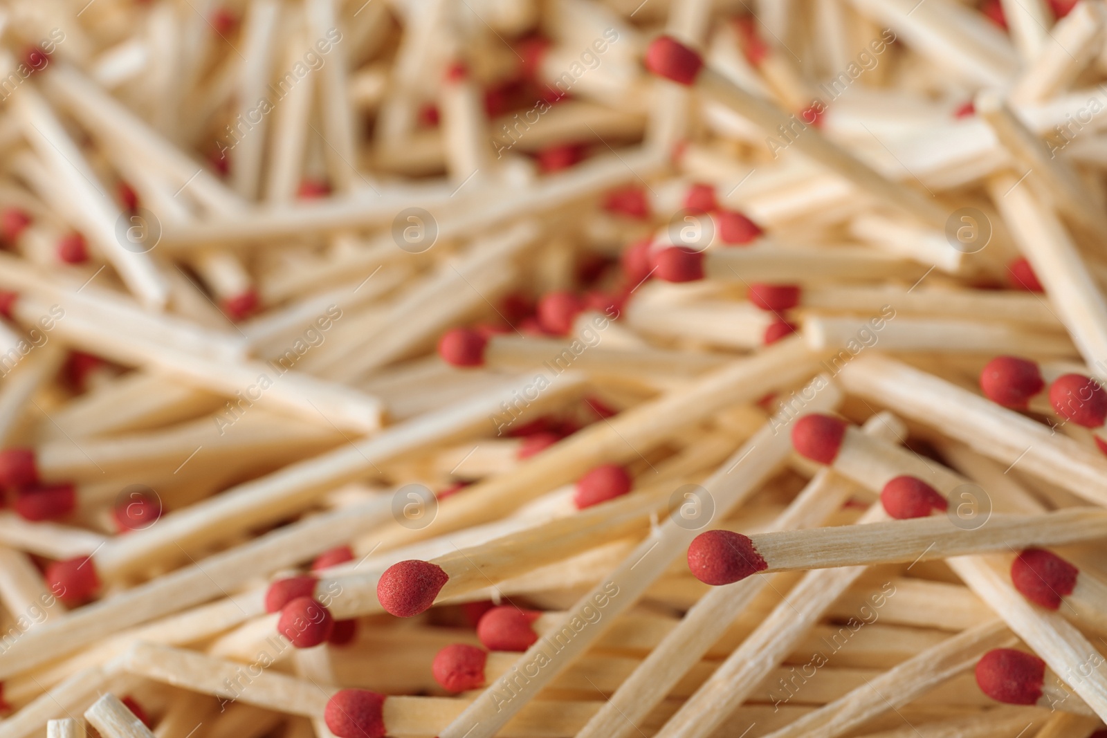 Photo of Pile of wooden matches as background, closeup