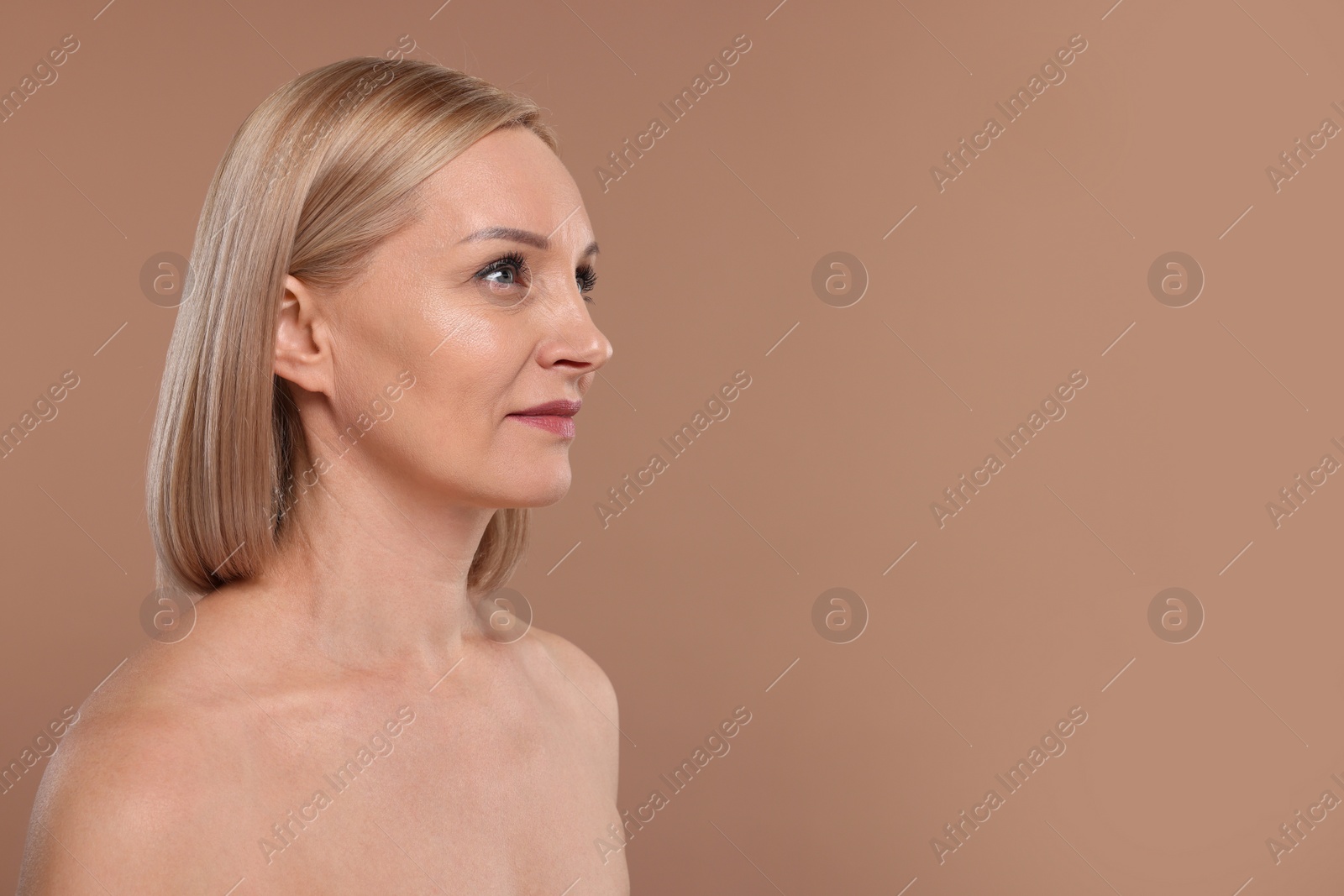 Photo of Beautiful woman with healthy skin on beige background. Space for text