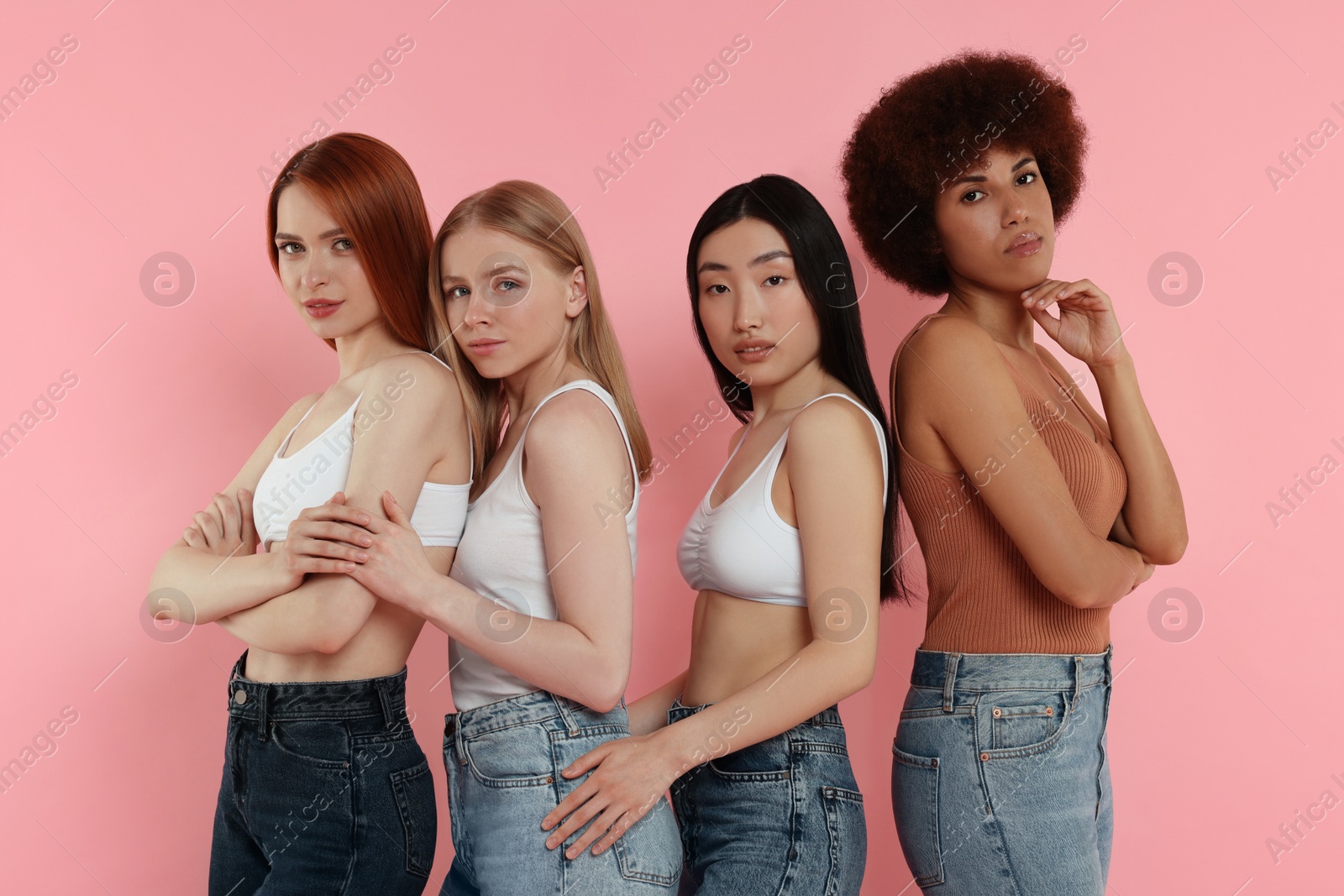 Photo of Portrait of beautiful young women on pink background