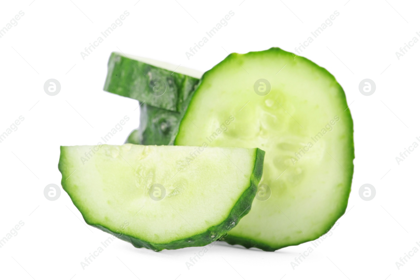 Photo of Slices of fresh cucumber on white background