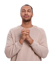 Photo of African American man with clasped hands praying to God on white background