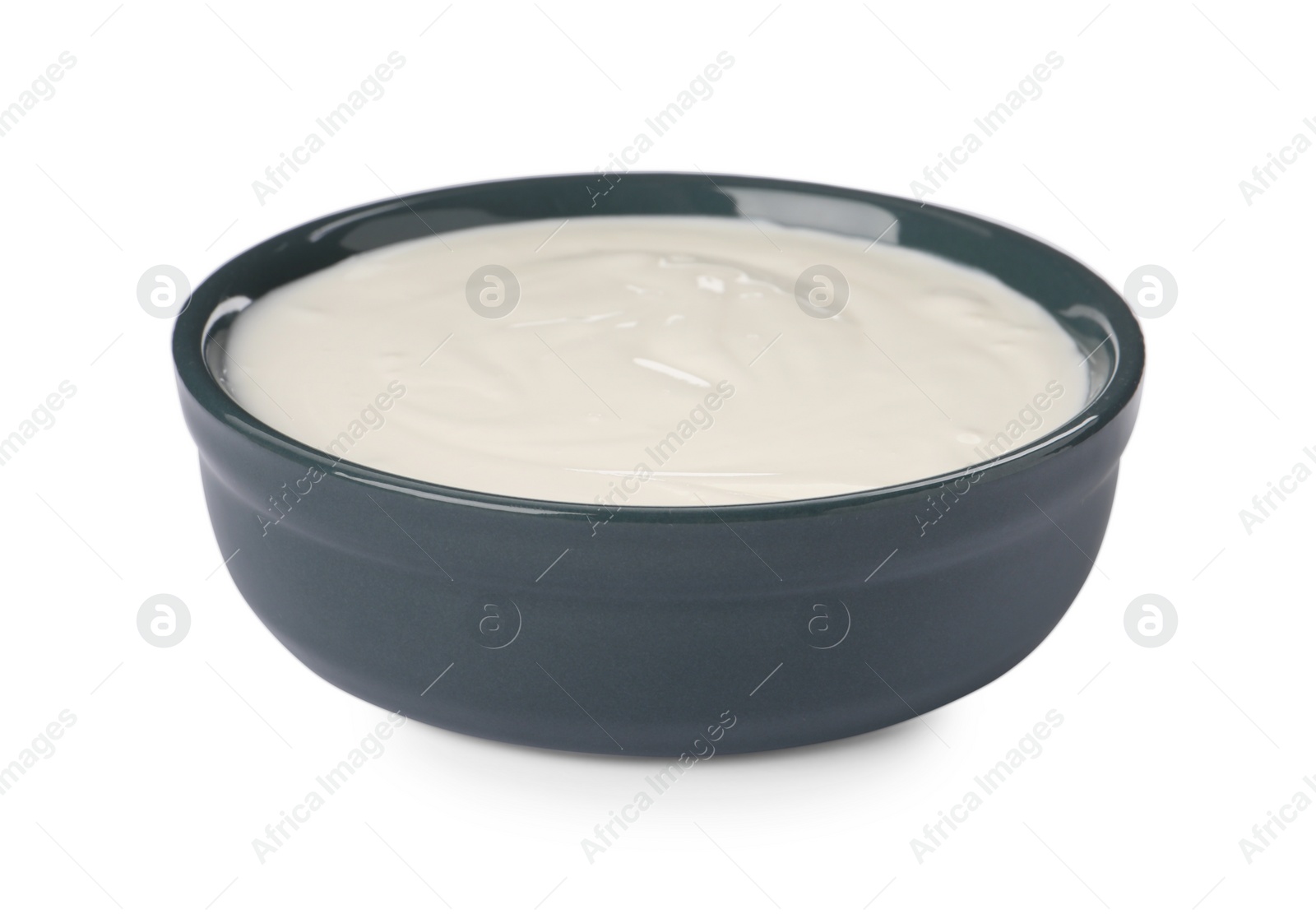 Photo of Bowl with delicious organic yogurt isolated on white