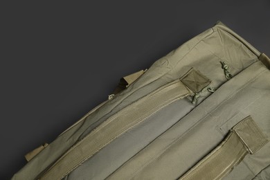 Photo of Army bag on dark grey background, top view. Military equipment