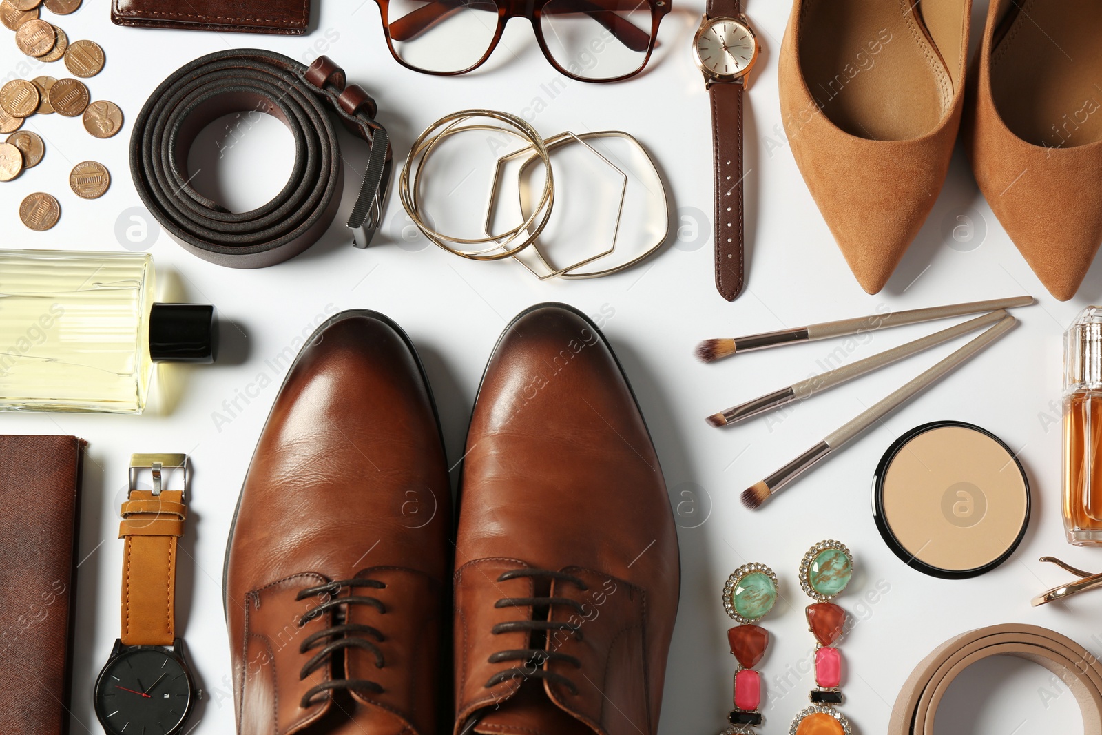 Photo of Fashionable male and female accessories on white background, flat lay