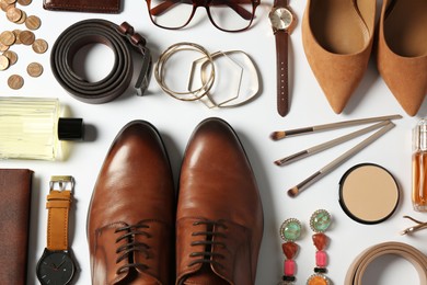 Photo of Fashionable male and female accessories on white background, flat lay