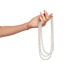 Young woman with elegant pearl necklace on white background, closeup