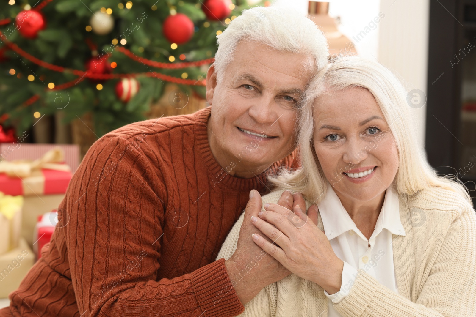 Photo of Happy mature couple at home. Christmas celebration