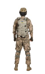 Photo of Soldier in Ukrainian military uniform with tactical goggles and backpack on white background, back view