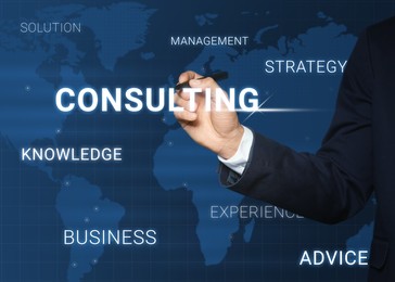 Image of Man pointing at word CONSULTING on virtual screen, closeup