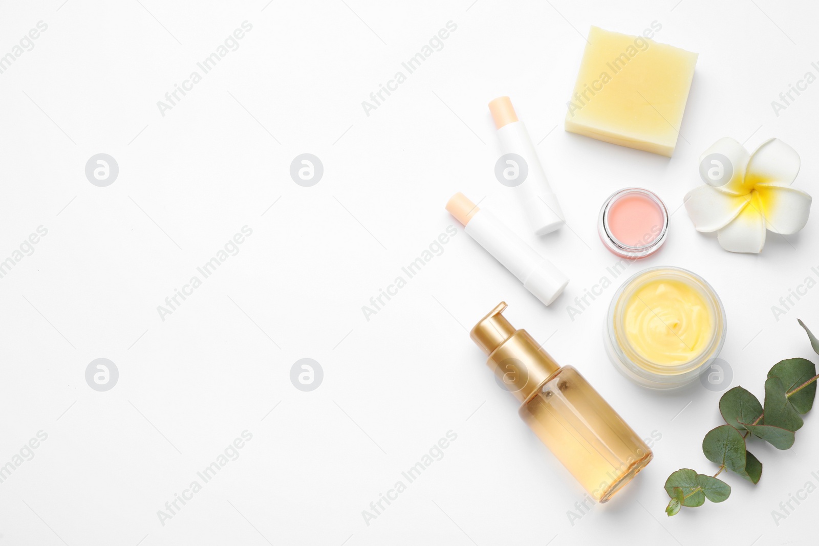 Photo of Flat lay composition with beeswax cosmetics on white background. Space for text