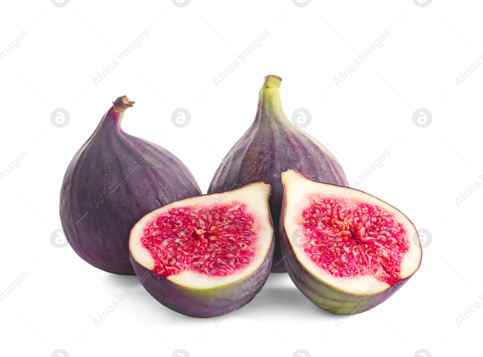 Photo of Whole and cut purple figs on white background