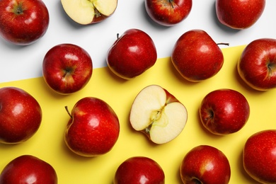 Photo of Flat lay composition with ripe juicy red apples on color background