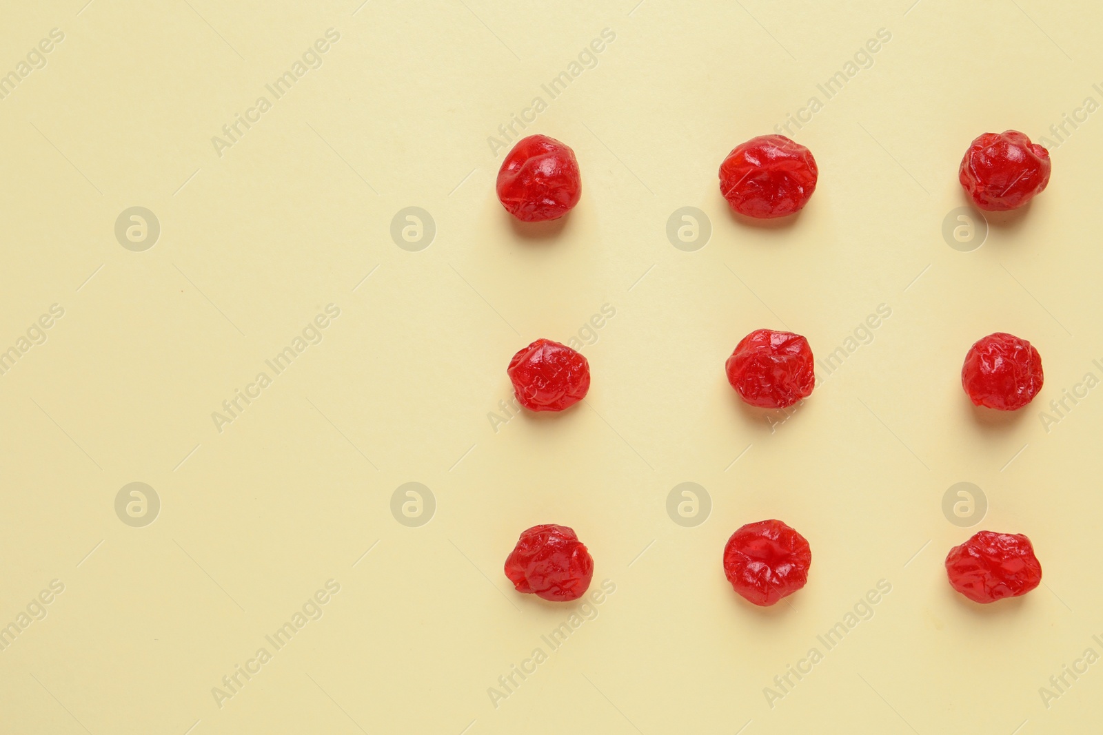 Photo of Flat lay composition of cherries on color background, space for text. Dried fruit as healthy snack