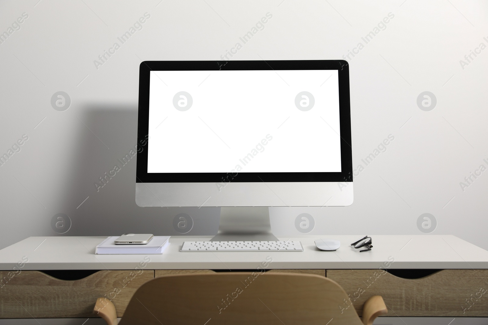 Photo of Workplace with modern computer and smartphone on white table. Mockup for design